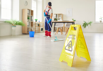 Busy cleaner working, professional janitor service completing cleaning task at home, office, active...