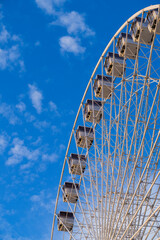 Ferris wheel on a blue sky