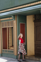 young beautiful woman in vintage suit in european city
