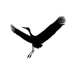 Solid black silhouette of a stork flying