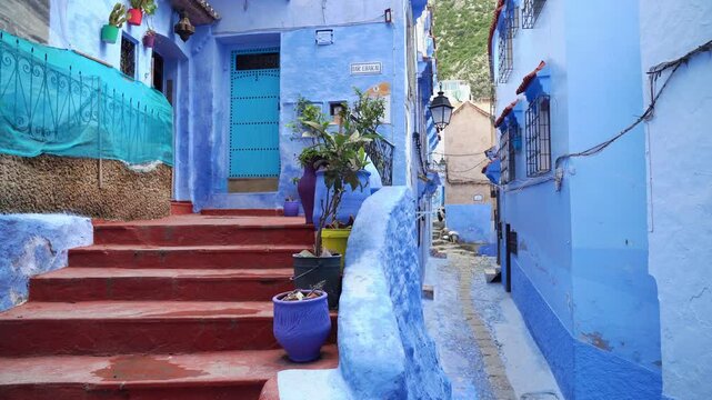 Chefchaouen, Morocco, is a breathtaking mountain town where blue-washed alleyways lead to hidden riads and peaceful courtyards