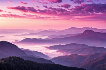 Fototapeta premium Pink and Purple Sunrise Over Misty Mountain Ridge.