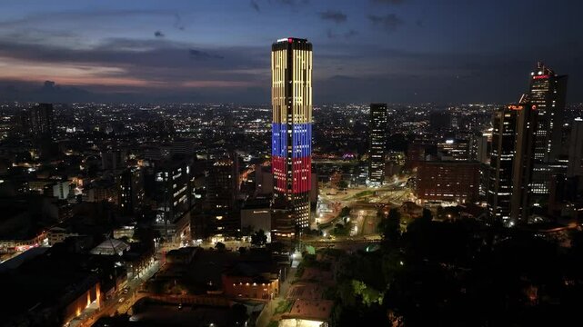 Colpatria Tower At Bogota In District Capital Colombia. Illuminated Downtown. Sunset City Landscape. Bogota At District Capital Colombia. Financial District. Night City Scene.