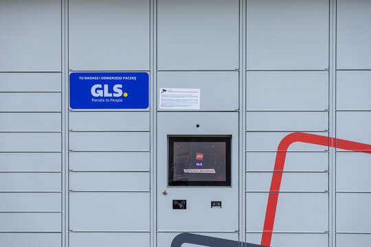 GLS Parcel Locker, an automated grey terminal facilitating convenient package sending and collection, promoting efficient logistics and e-commerce delivery services for modern urban customers
