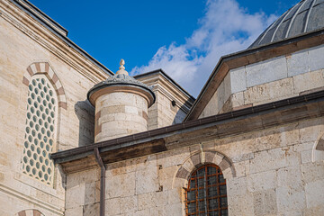 Ottoman style mosque exterior detail. Architectural close-up of a small turret capped with a lead dome. Reflecting the cultural and historical significance of the structure.