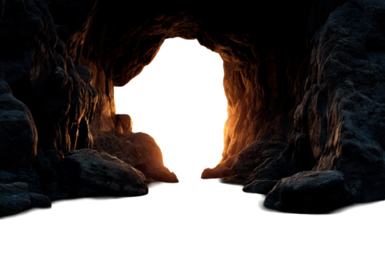 Cave entrance with glowing light at dusk in a rocky landscape