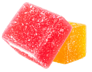 Two colorful fruit jelly cubes covered in sugar crystals on transparent background