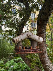 wooden bird feeder made of twigs 