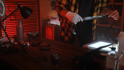 Person Working in a Darkroom Developing Film Photographs