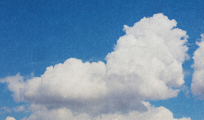 halftone blue sky and soft white clouds. Dotted retro background design. Vintage nostalgic artistic backdrop.
