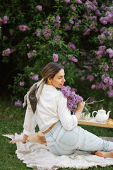 Woman Embraces Fragrant Lilac Blooms In Spring