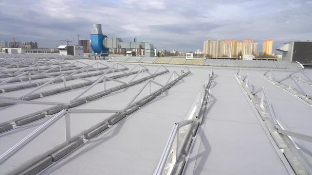 A frame and trusses for mounting solar panels on the roof of the building have been installed.