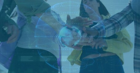 Team members placing hands in tech collaboration, showing holographic data globe with rings - Powered by Adobe