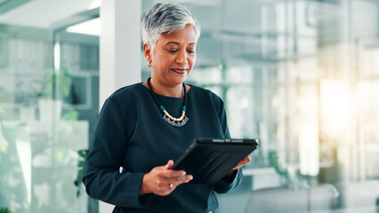 Fototapeta na wymiar App, research or tablet with business woman in office for information, project management, report. Corporate, internet or review with mature employee in professional workplace for company development