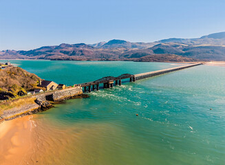 An aerial view towards the railway bridge at Barmouth, Wales in springtime