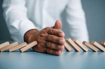 Preventing Domino Effect Business Risk Management Strategy Hand Stops Falling Blocks