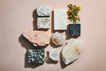 Flat Lay Images of Various Sized Stones in a Textured Composition