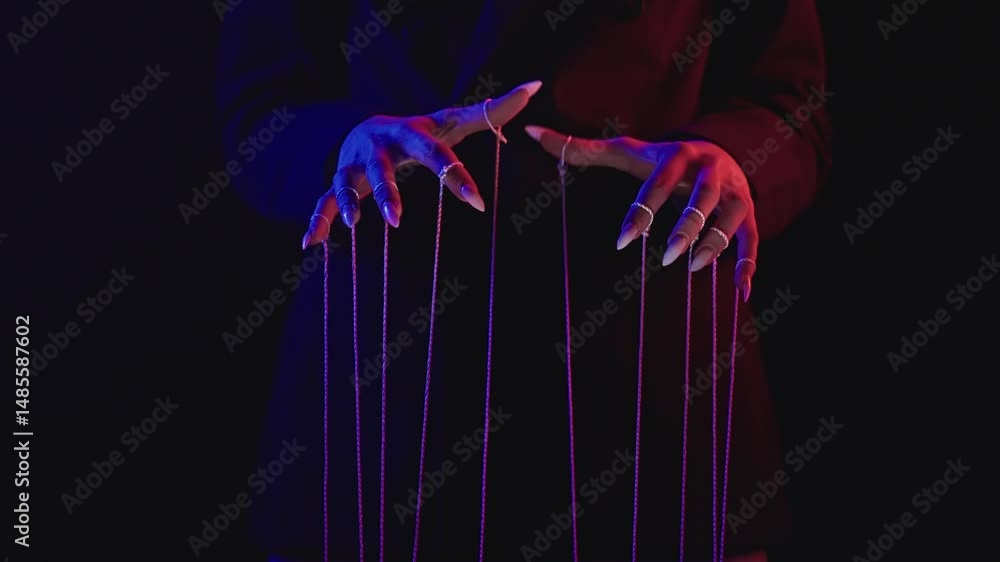 Poster conceptual image of manipulation with hands and strings