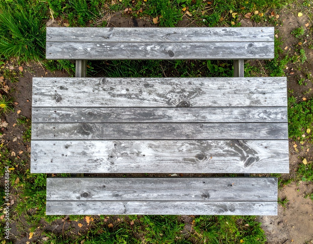 Poster overhead view of rustic wooden picnic table in grassy park. perfect for design projects needing a na