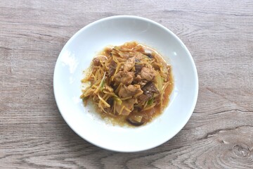 stir fried chicken with slice ginger and black ear mushroom on plate
