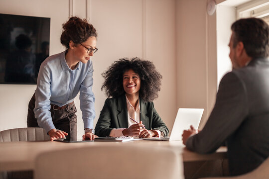 Colleagues Engaged in a Friendly Business Meeting Setting