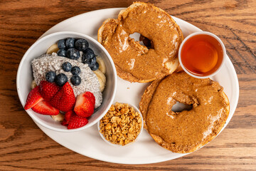 almond butter on a bagel with chia pudding