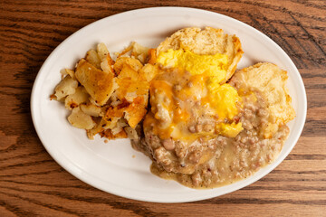 Biscuit with home fries and sausage gravy