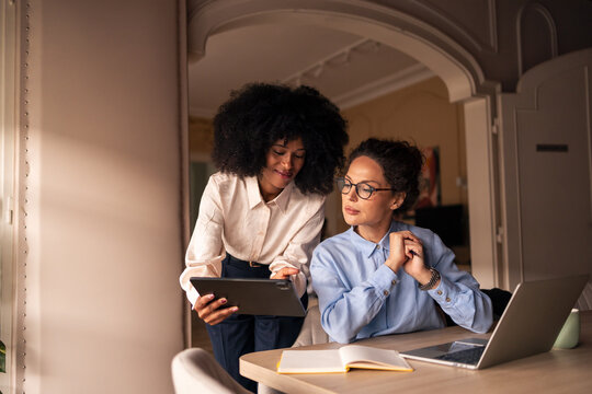 Professional Collaboration Between Two Women in a Cozy Office Environment - Powered by Adobe