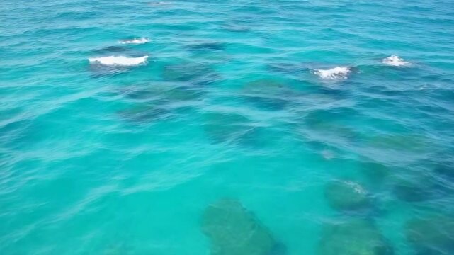 Turquoise ocean water with rocks
