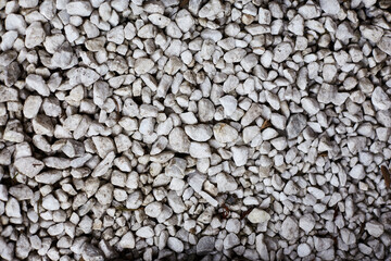 White gravel stones arranged closely together in a natural landscape