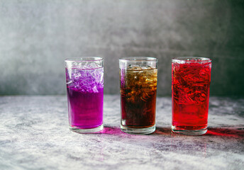 A lot of Soft drinks in colorful and flavorful glasses on the table,Glasses with sweet drinks with...