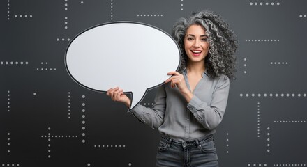 The woman is holding a large white speech bubble. Visual Concept.