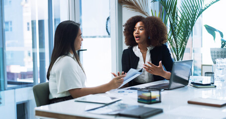 Obraz premium Business women, strategy and team planning in office, discussion or brainstorming insurance policy with paper. Laptop, meeting or conversation with manager for report, risk management or explain idea