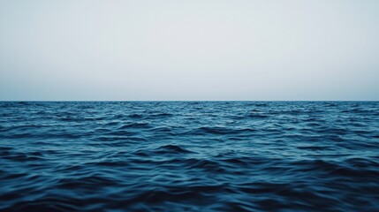 Fototapeta premium Calm ocean waves gently rolling under a serene sky, creating a tranquil scene