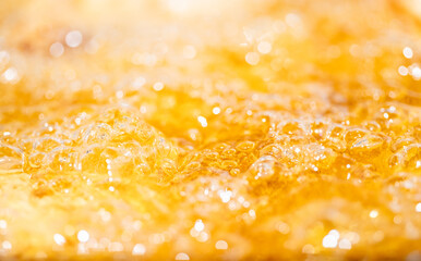 Close up bright orange Oil or beer splash texture and nature waves, Beautiful waves curve and...
