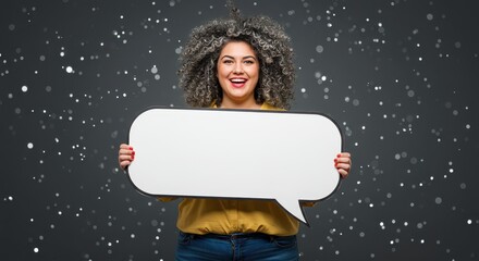 The woman is holding a large white speech bubble. Visual Concept.