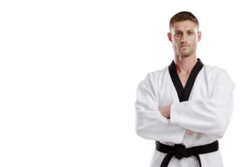  martial artist confidently posing in traditional uniform with arms crossed isolated on white background