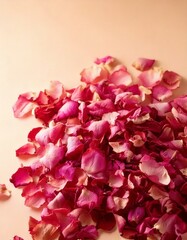 Fototapeta premium A neat pile of dried rose petals in shades of soft pink and crimson