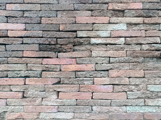Brick wall presents rustic yet calming texture, evoking sense of enduring strength and timeless appeal with its blend of colors