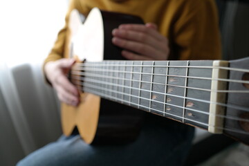 Fototapeta premium guy holding guitar music lesson