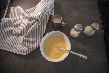 Making an omelette at home in the kitchen on the countertop