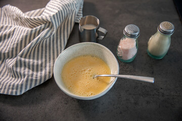 Making an omelette at home in the kitchen on the countertop