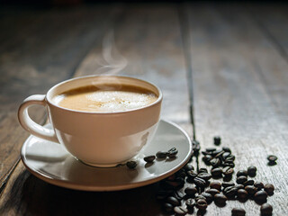 Coffee cup and coffee beans on wooden table, Espresso Crema coffee cup aromatic