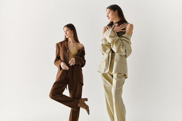 Stylish twin sisters showcasing vibrant fashion choices in a modern setting