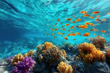 Fototapeta premium Vibrant coral reef teeming with colorful fish underwater.