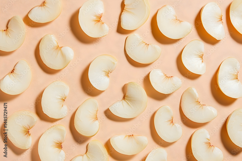Aufkleber delicate pear slices arranged in a subtle pattern on a soft peach backdrop.