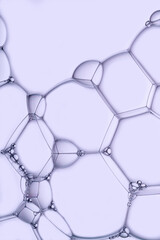 Macro photo of soap bubbles on a violet background