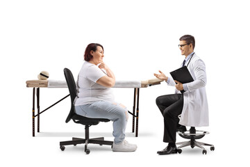Overweight woman talking to a male physician
