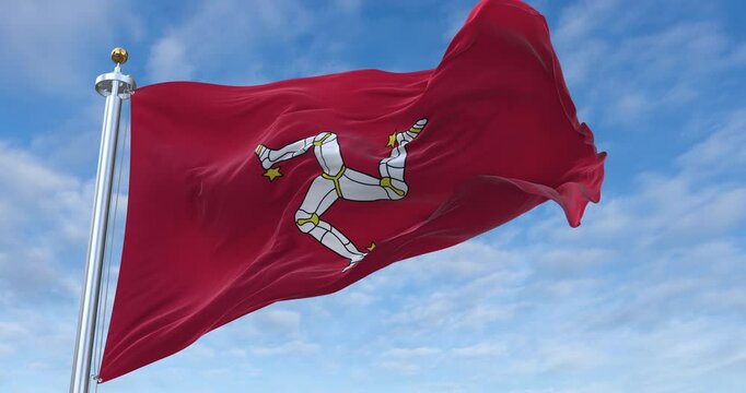 Isle of Man flag with flagpole waving in wind, rolling clouds background looping, 4K video (Perfect Loop)