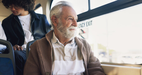 Old man, thinking and travel on bus ride to destination for public transport, holiday and vacation. Memory, adventure or elderly tourist by window in city transportation for retirement and explore © AzeemudDeen/peopleimages.com